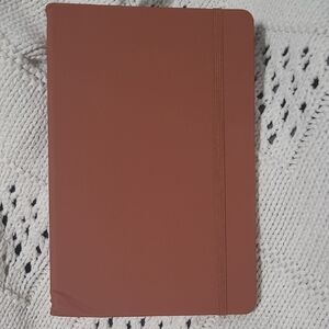 One large dented Notebook.